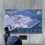 Woman points to map of Naval Academy