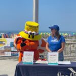 Julie Lang and "Martin Z. Mollusk," who is the mascot of Ocean City.