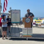 Dr. Pete Rowe and Samantha Kreisler announce the winners of the Favorite Beaches Contest.