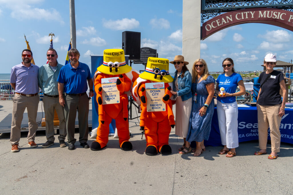 Ocean City and NJSGC staff holding awards for Favorite Beaches Contest. 